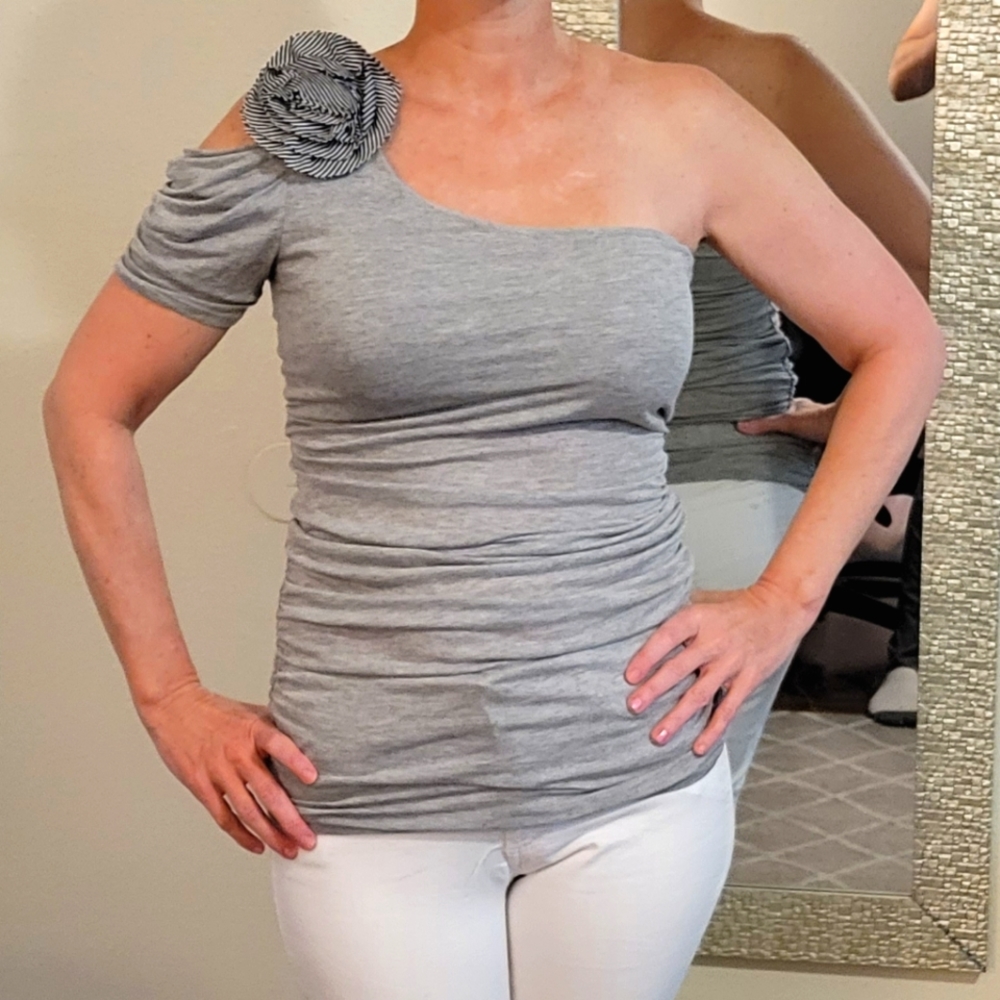 Cute heather grey top with flower, off the shoulder.